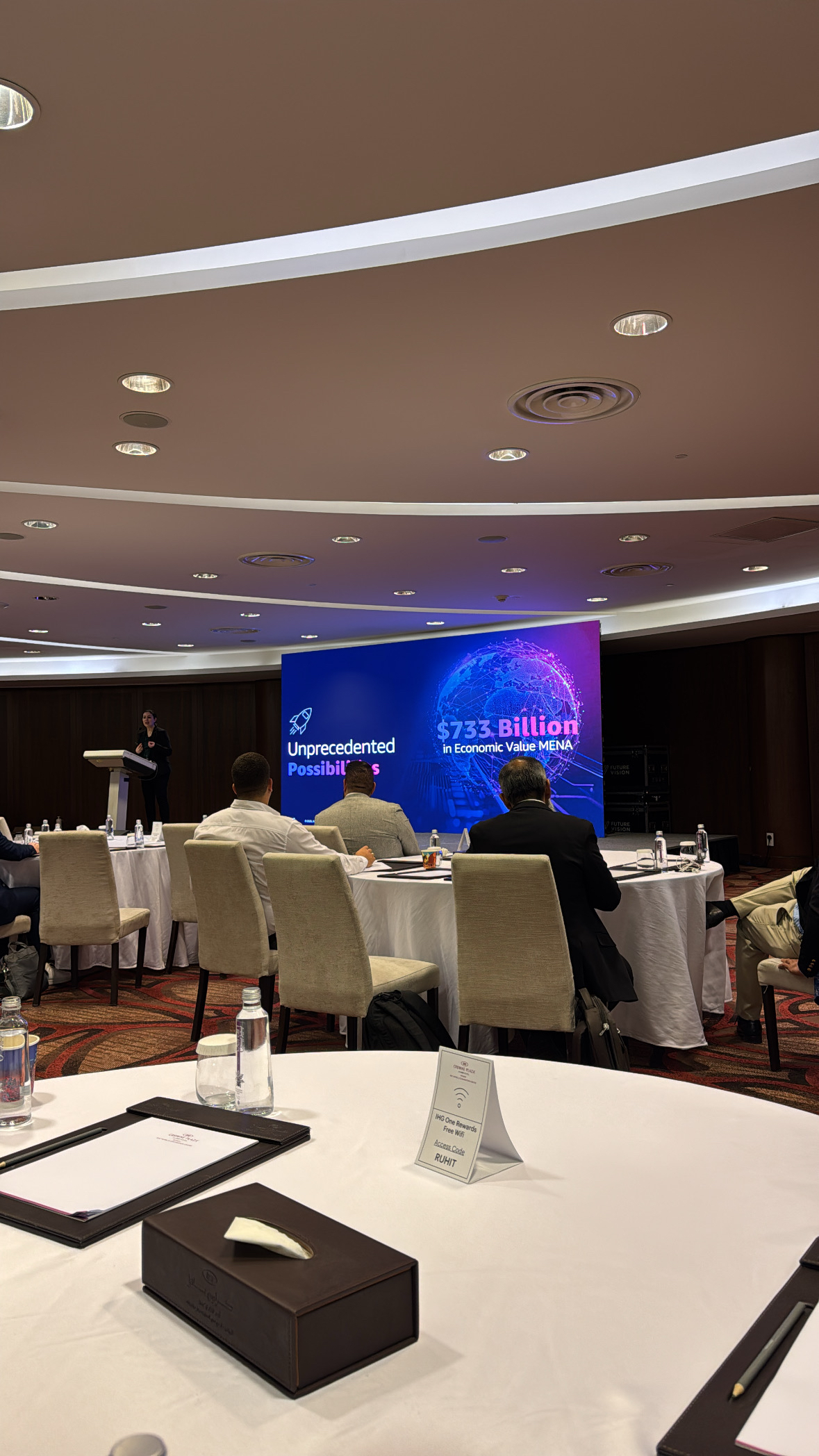 A digital display at the Riyadh event showing "Unprecedented Possibilities" and a projected $733 billion in economic value for the MENA region by 2026.