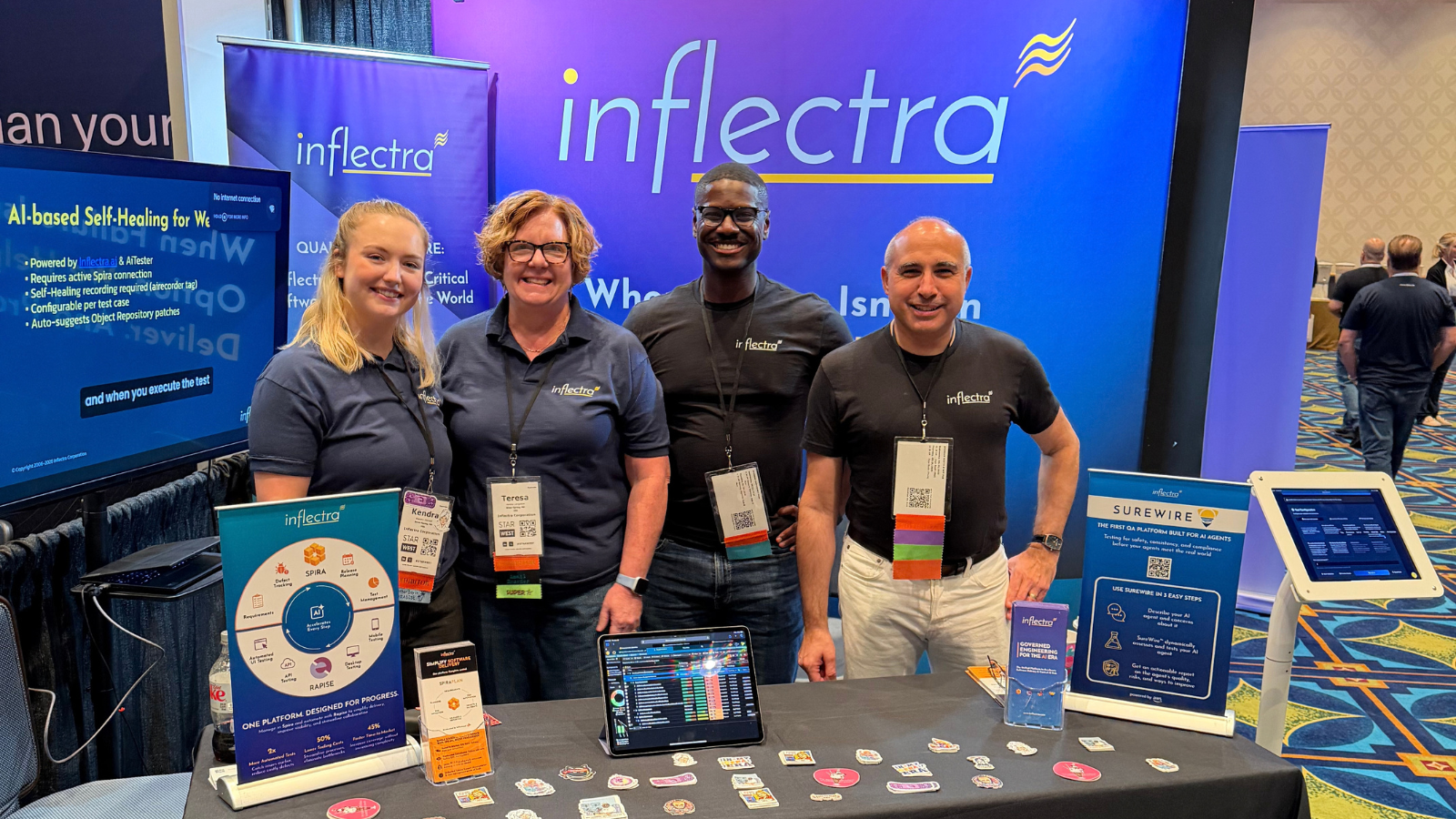 Inflectra STARWEST 2026 team standing at the expo booth